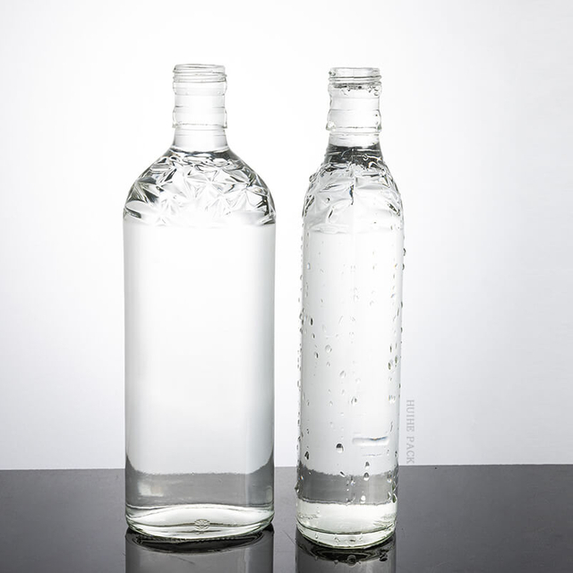 500 ml flach runde geprägte Glasgetränkeflasche mit Schraubenkappe