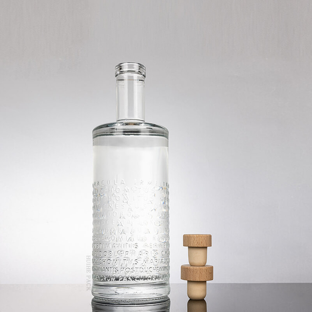 Erh&ouml;hte Buchstaben strukturierte Zylinderglasflasche Flasche