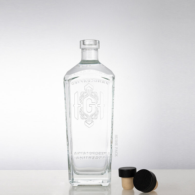 'G'-embossed abgewinkelte Kanten rechteckige Glasfl&uuml;ssigkeitsflasche