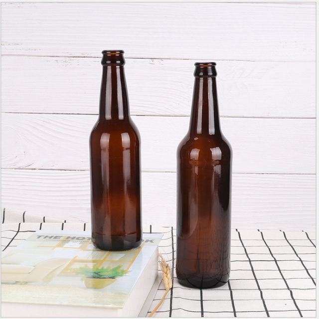 Bernsteinfarbene grünblaue Glasbierbrau-Verpackungsflaschen