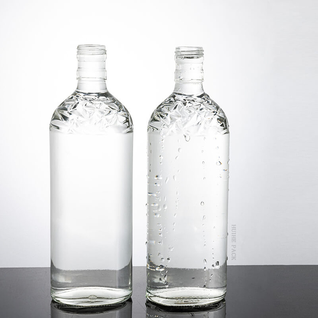 500 ml flach runde geprägte Glasgetränkeflasche mit Schraubenkappe