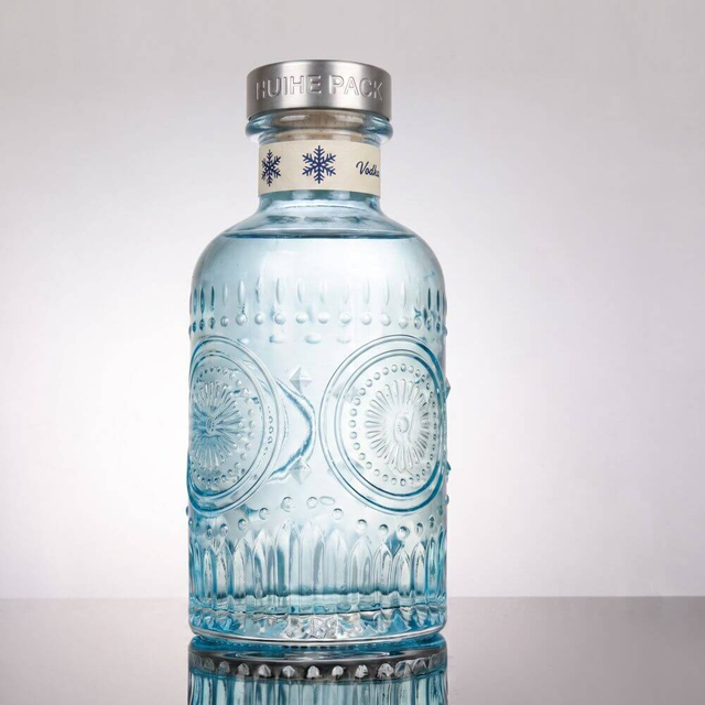 Aufw&auml;ndige florale - inspirierte Glasfl&uuml;ssigkeitsflasche mit dickem Hals